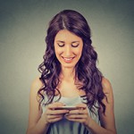 Woman holding using new smartphone connected browsing internet w